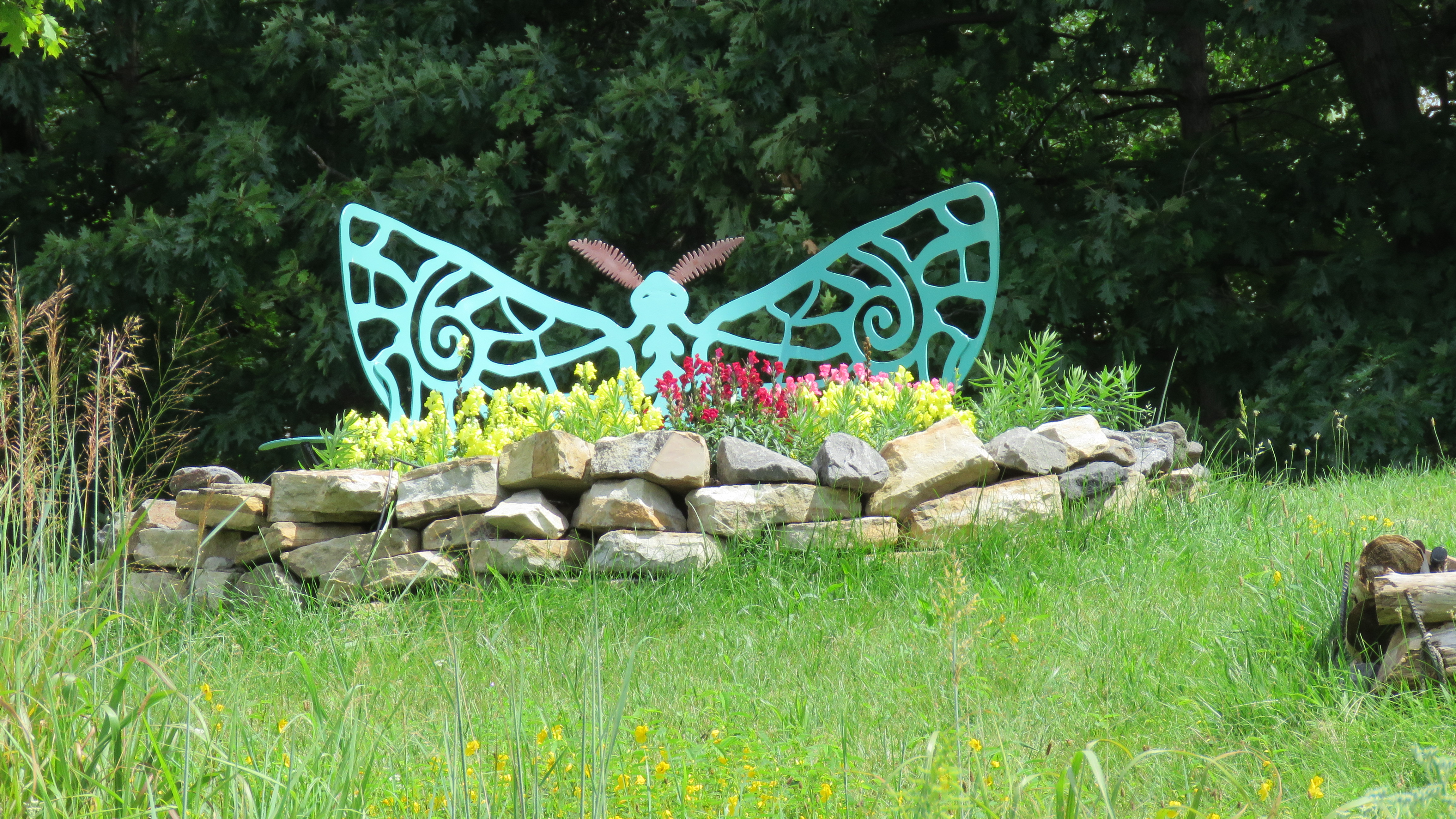 Butterfly bench overlooking pollinator garden